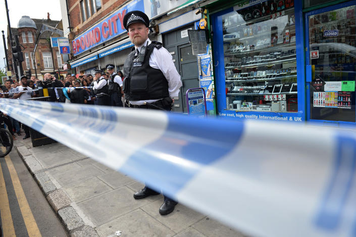 <p>A police officer stands outside a store in East Ham in London, June 4, 2017, following a raid as police continue their investigations following the June 3 terror attacks in central London. (Photo:Justin TallisAFP/Getty Images) </p>
