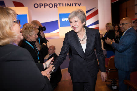 Britain's Prime Minister Theresa May greets supporters after her speech at the Conservative Party conference at the International Convention Centre, Birmingham, Britain October 3, 2018. Stefan Rousseau/Pool via Reuters