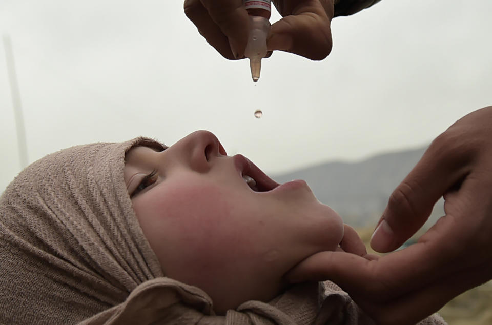 An Afghan health worker administers the polio vaccine to a child during a vaccination campaign in Kabul on Feb. 28, 2017.