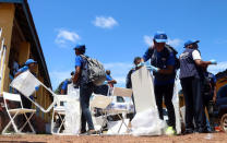 World Health Organization (WHO) workers prepare a centre for vaccination during the launch of a campaign aimed at beating an outbreak of Ebola in the port city of Mbandaka, Democratic Republic of Congo May 21, 2018. REUTERS/Kenny Katombe