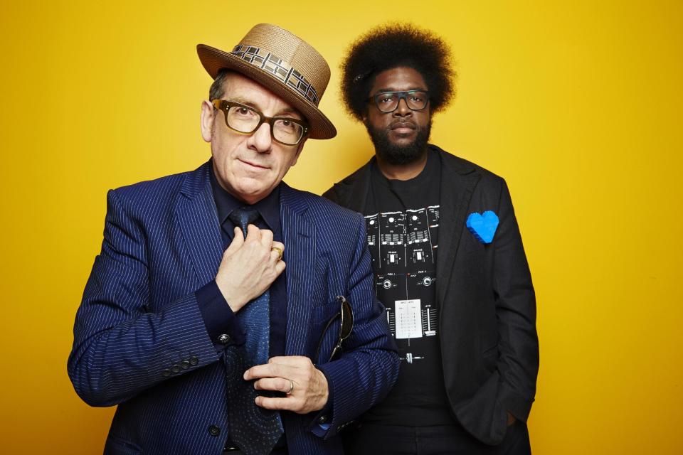 From left, English singer-songwriter Elvis Costello poses for a portrait with drummer Ahmir "Questlove" Thompson of "The Roots," in promotion of their upcoming album "Wise Up Ghost," Tuesday, May 21, 2013, in New York. (Photo by Dan Hallman/Invision/AP)