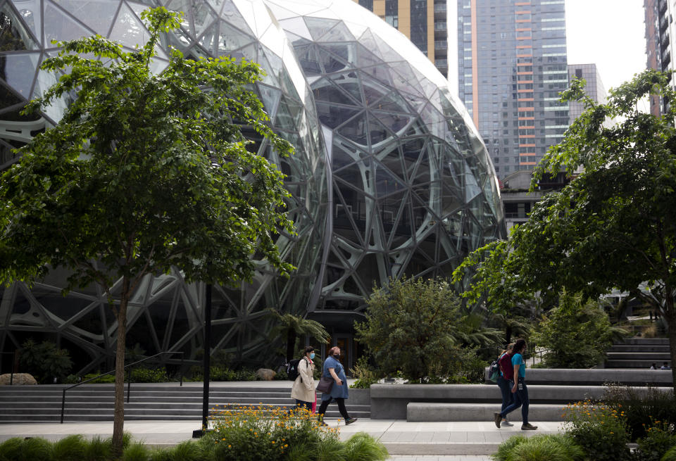 People wearing masks outside the Amazon campus in Seattle, Wash., on April 30, 2020. | Lindsey Wasson—Getty Images