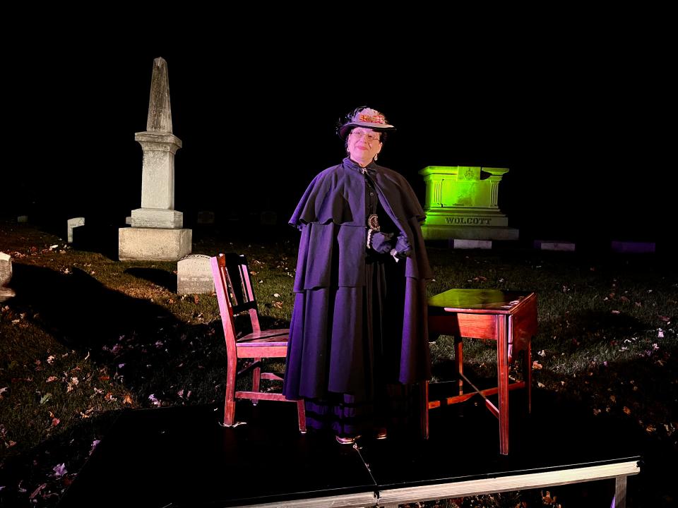 An actor portraying Laura Ross Wolcott, Wisconsin's first female physician, talks to visitors at the Forest Home Cemetery 