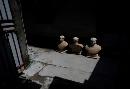 The Wider Image: Busts of leaders a hit in China's porcelain capital
