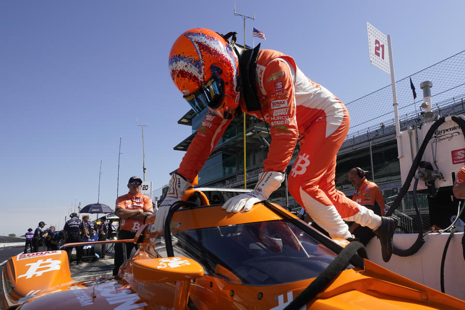 Rinus VeeKay, of The Netherlands, climbs into his car during practice for the Indianapolis 500 auto race at Indianapolis Motor Speedway, Tuesday, May 17, 2022, in Indianapolis. (AP Photo/Darron Cummings)