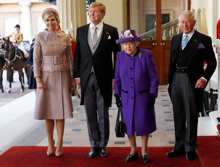 Britain's Queen Elizabeth and Prince Charles, and King Willem-Alexander and Queen Maxima of the Netherlands arrive at Buckingham Palace, in London, Britain October 23, 2018. REUTERS/Peter Nicholls