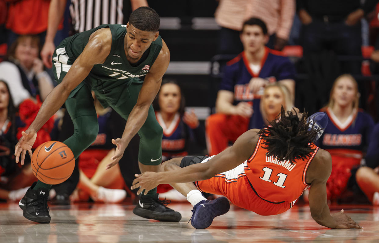 Illinois' Ayo Dosunmu slips and is injured on the final play of the game sealing the win for Michigan State on Tuesday night in Champaign, Illinois.