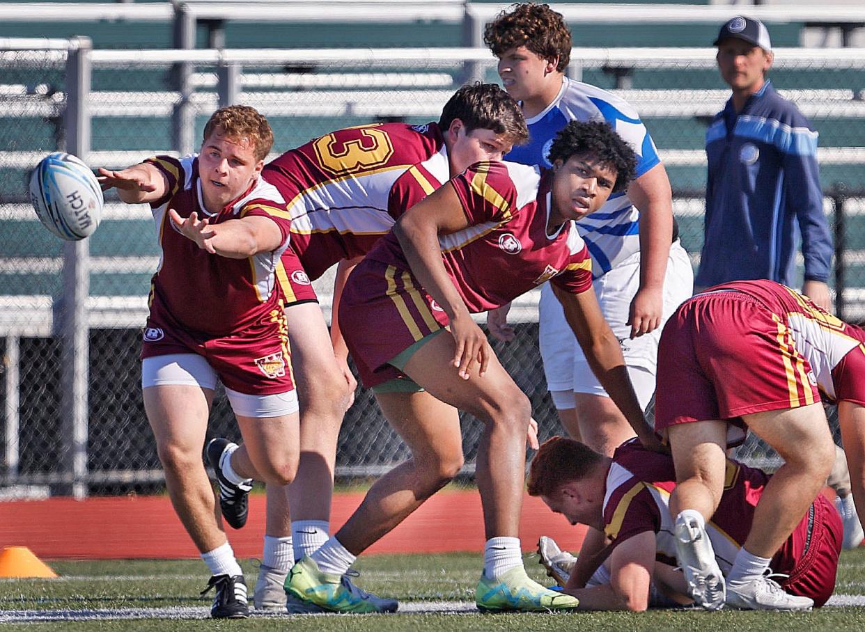 Weymouth's Josh Cullivan pitches the ball to another player after a scrum in a rugby match against Braintree on Friday, May 3, 2024.