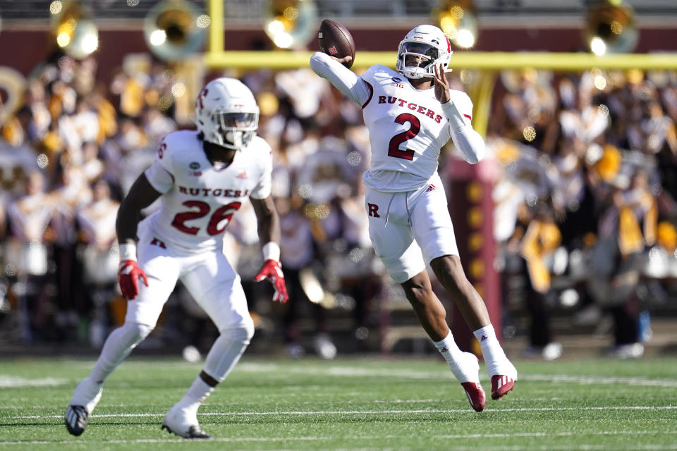 Rutgers quarterback Gavin Wimsatt (2), right, passes the ball during the first half of an NCAA college football game against Minnesota, Saturday, Oct. 29, 2022, in Minneapolis. (AP Photo/Abbie Parr)