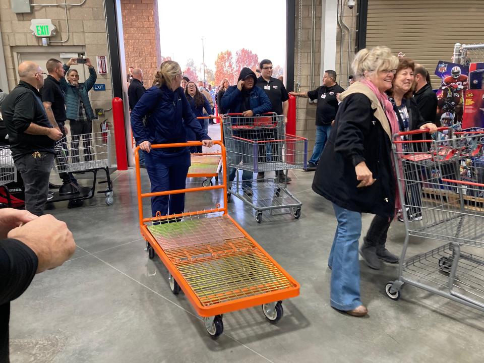 Shoppers pour into the new Costco soon after it opens on Tuesday, Nov. 22, 2022.