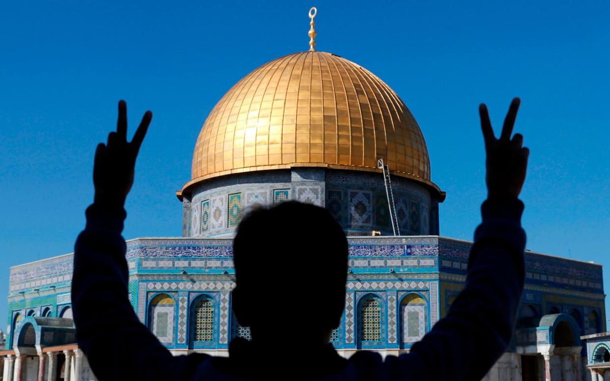 A Palestinian youth in Jerusalem's Old City - AFP