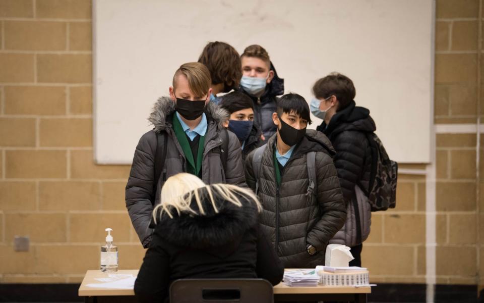 Pupils at Sydney Russell School, Dagenham, east London queue up to be tested for Covid-19  - Stefan Rousseau/PA