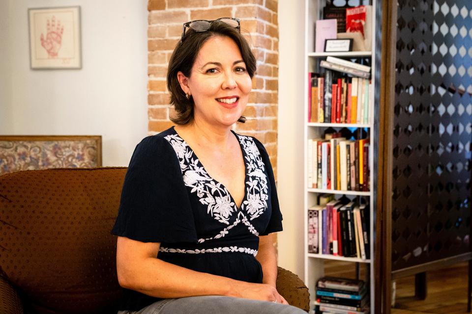 Jennifer Colville, founder of the Porch Light Literary Center, poses Sept. 14 in Iowa City. Colville is one of three local artists who received $10,000 state grants to help them continue their work.