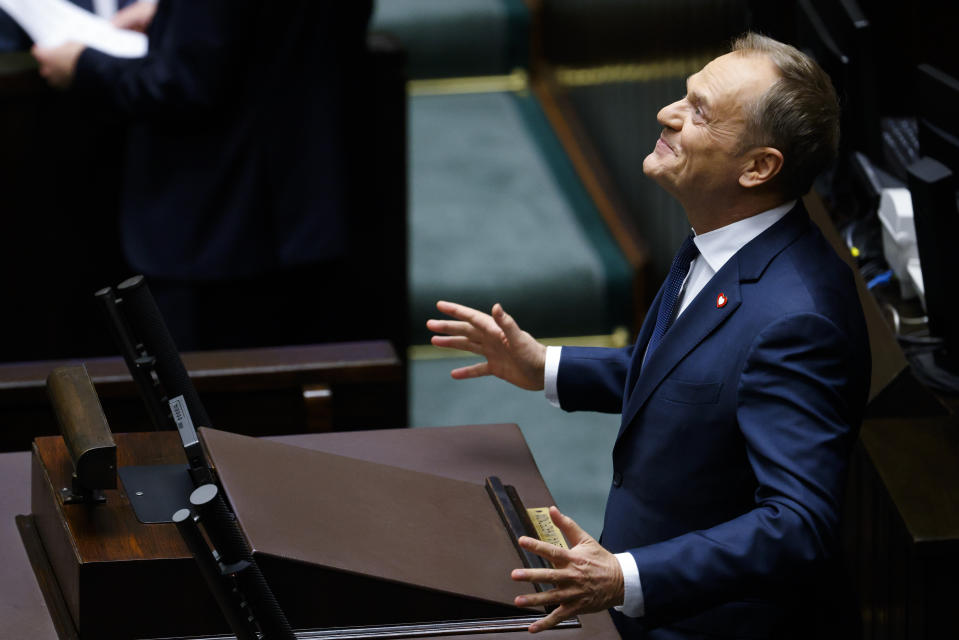 Donald Tusk reacts as he speaks to lawmakers after he was elected as Poland's Prime Minister at the parliament in Warsaw, Poland, Monday Dec. 11, 2023. (AP Photo/Michal Dyjuk)