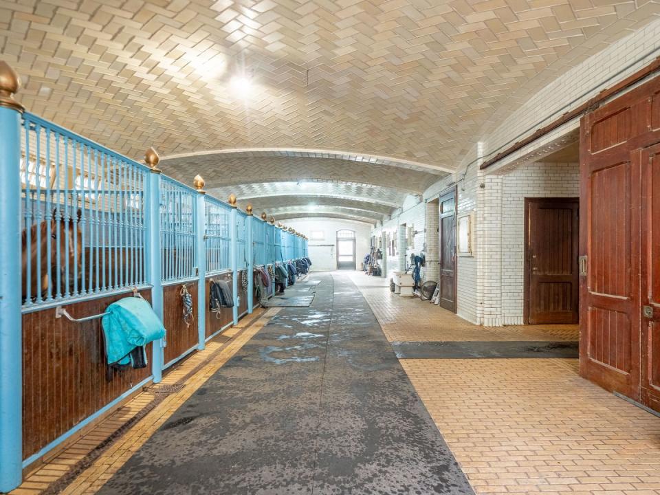 The 18-stall granite stable features Guastavino's iconic tiled ceilings.