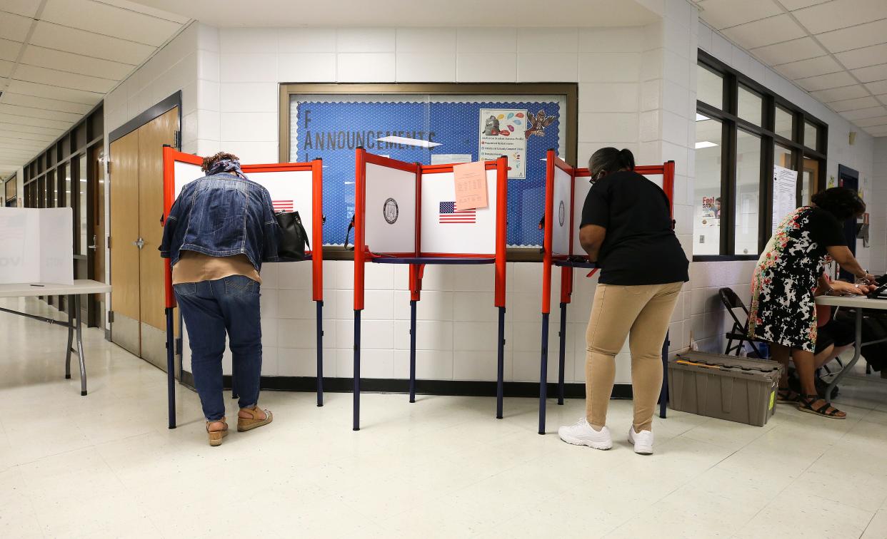 Voters cast their ballots on primary election day at the McFerran Elementary School in Louisville, Ky. on May 17, 2022.  