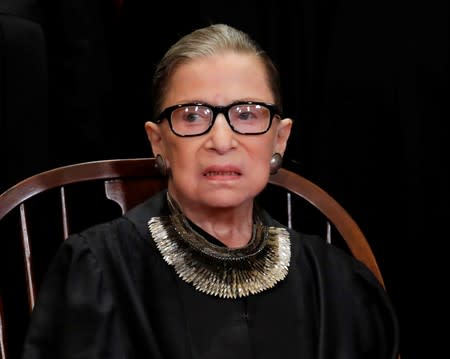 FILE PHOTO: U.S. Supreme Court Justice Ruth Bader Ginsburg poses during group portrait at Supreme Court in Washington