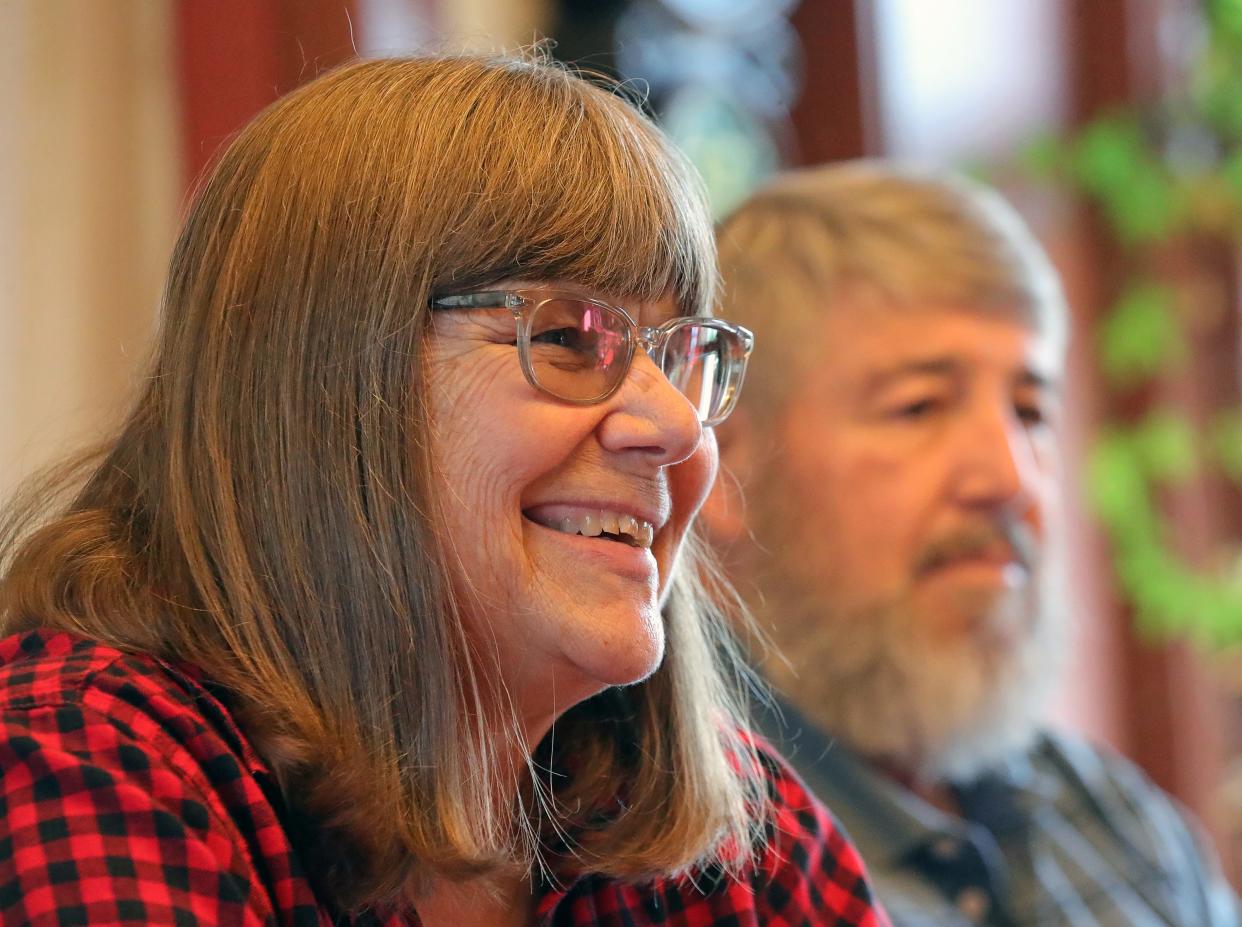 Carol Haramis, left, smiles as she discusses the history of Heritage Farms with her husband, George, in Peninsula.