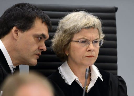 Judges Wenche Elizabeth Arntzen (right) and Arne Lyng speak during the opening of the trial of rightwing extremist Anders Behring Breivik, who killed 77 people in twin attacks in Norway last year, in Oslo district courtroom