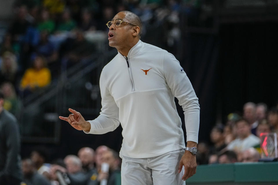 Texas head coach Rodney Terry talks to his team during the first half of an NCAA college basketball game against Baylor, Monday, March 4, 2024, in Waco, Texas. (AP Photo/Julio Cortez)