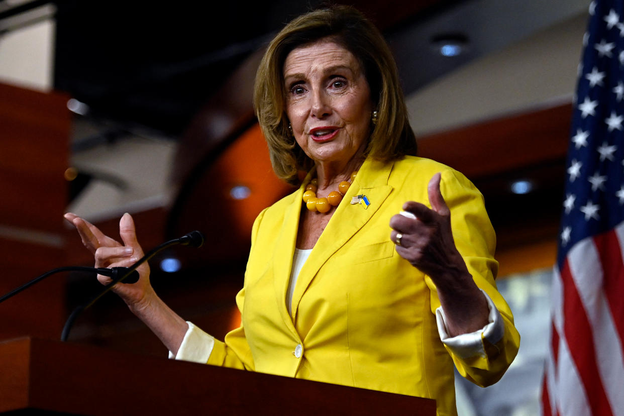 pelosi-biden-climate-bill-passing.jpg politics-diplomacy - Credit: Olivier Douliery/AFP/Getty Images