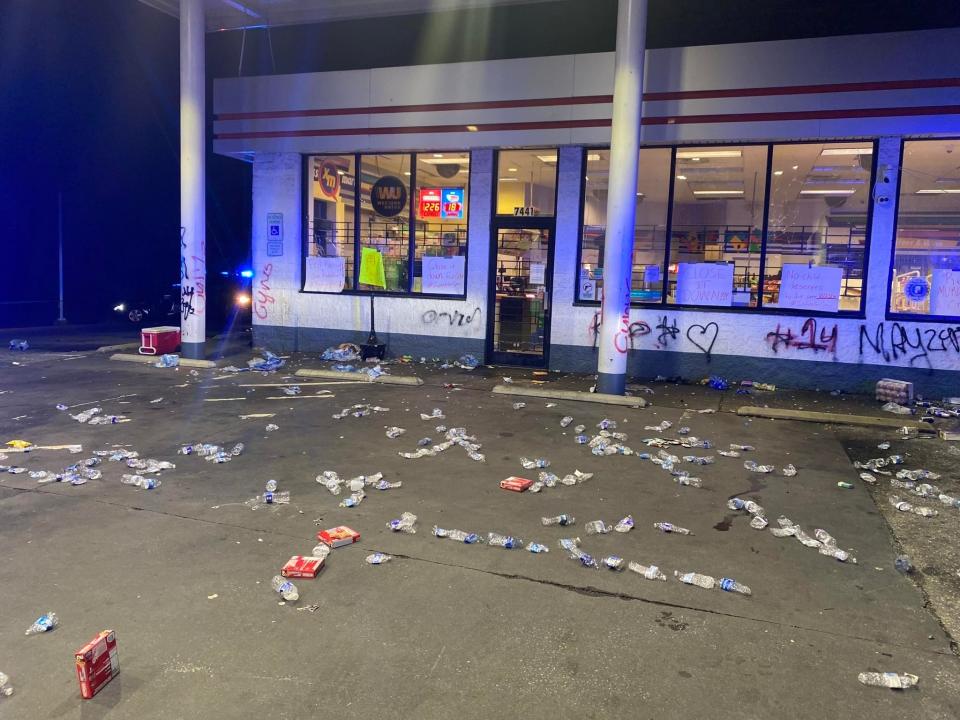 Columbia, S.C. community members place empty water bottles outside of the gas station where  14-year-old Cyrus Carmack-Belton encountered Rick Chow. 
