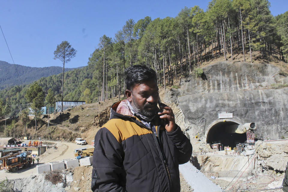 Haridwar Sharma waits for news of his brother Sushil, who is among those trapped inside an under-construction road tunnel that collapsed in Silkyara in the northern Indian state of Uttarakhand, Friday, Nov. 24, 2023. Rescuers are racing to evacuate 41 construction workers who have been trapped for nearly two weeks. “We are all waiting here, hoping they come out. It is not in our hands ... the administration is at it, the machinery is there. With God's blessing, we are hopeful,” he said. (AP Photo)