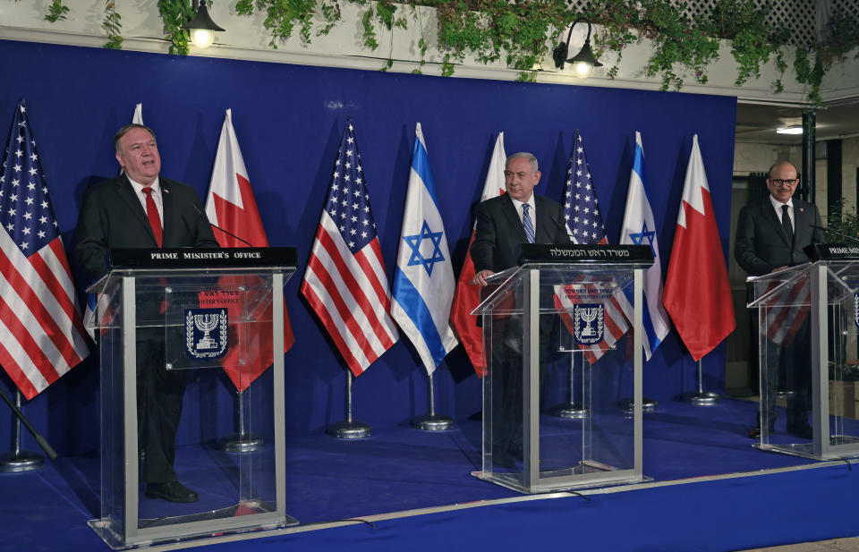 Israeli Prime Minister Benjamin Netanyahu, center, and Bahrain's Foreign Minister Abdullatif bin Rashid Alzayani, right, listen as U.S. Secretary of State Mike Pompeo speaks during a joint press conference after their trilateral meeting in Jerusalem on Wednesday, Nov. 18, 2020. (Menahem Kahana/Pool via AP)