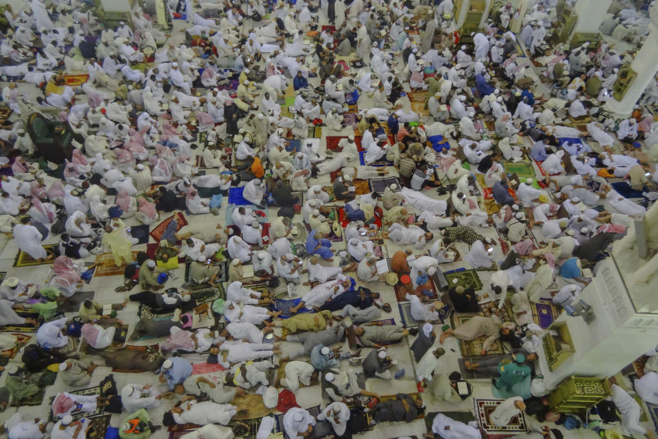 Muslim pilgrims rest inside the Grand Mosque, after offering Friday prayers ahead of the annual Hajj pilgrimage, in the Muslim holy city of Mecca, Saudi Arabia, Friday, Aug. 17, 2018.The annual Islamic pilgrimage draws millions of visitors each year, making it the largest yearly gathering of people in the world. (AP Photo/Dar Yasin)