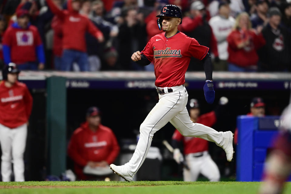 Cleveland Guardians' Andres Gimenez runs home to score on a single by Will Brennan during the sixth inning of Game 3 of the baseball team's AL Division Series against the New York Yankees, Saturday, Oct. 15, 2022, in Cleveland. (AP Photo/David Dermer)