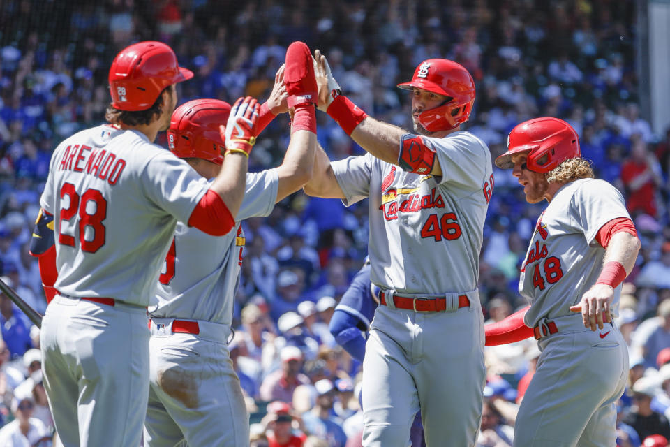 St. Louis Cardinals' Paul Goldschmidt (46) celebrates with teammates after hitting a three-run home run against the Chicago Cubs during the third inning of a baseball game, Friday, June 3, 2022, in Chicago. (AP Photo/Kamil Krzaczynski)