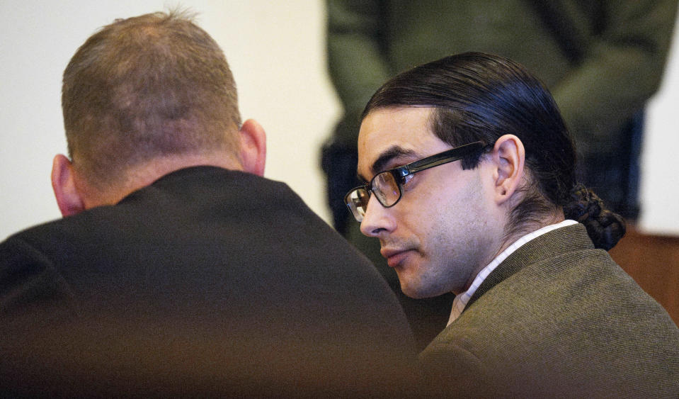 Defendant Marcus Eriz talks with his attorney Randall Bethune during court proceedings in Santa Ana, Calif. on Thursday, Jan. 25, 2024 A jury convicted the California man of murder for shooting to death a 6-year-old boy who was riding in the back of his mother's car on a busy freeway. (Paul Bersebach/The Orange County Register via AP)