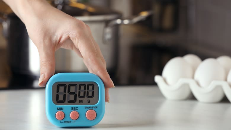 Kitchen timer at white table