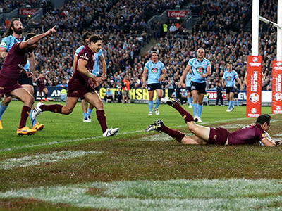 Cooper Cronk crosses for the first try of the match