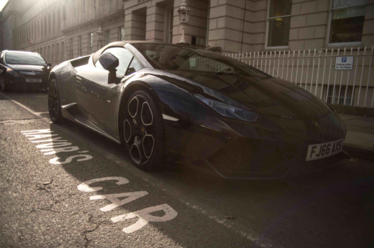 The fashion boss has also started to park his black Lamborghini in the mayor's space (SWNS)