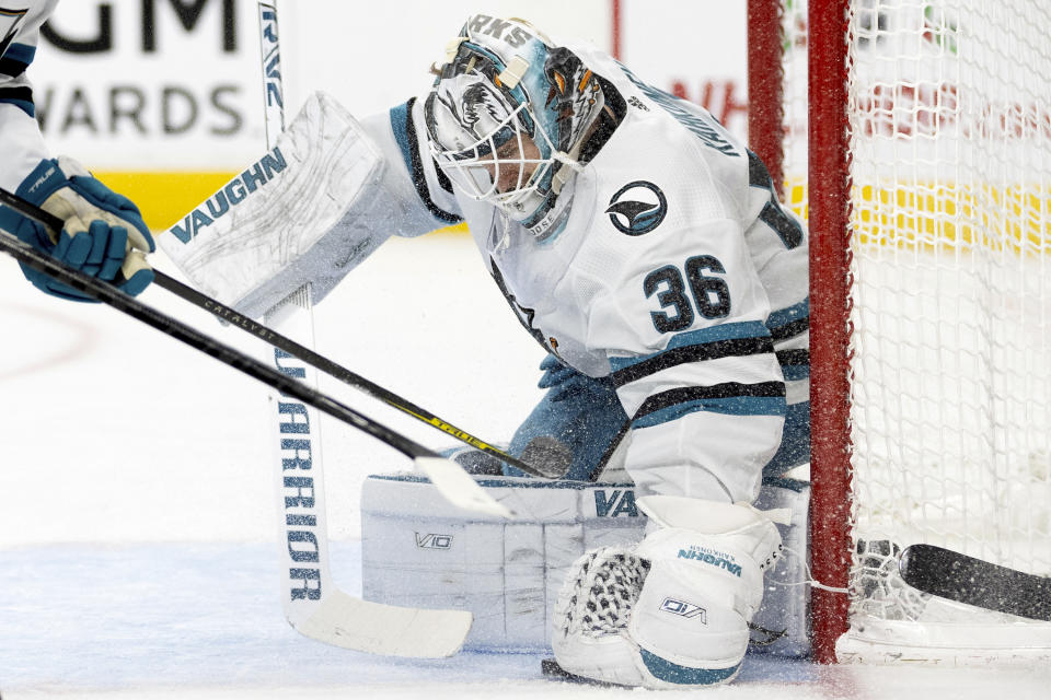 San Jose Sharks goaltender Kaapo Kahkonen (36) saves the puck during the second period of an NHL hockey game against the Vegas Golden Knights, Sunday, Dec. 10, 2023, in Las Vegas. (AP Photo/Ellen Schmidt)