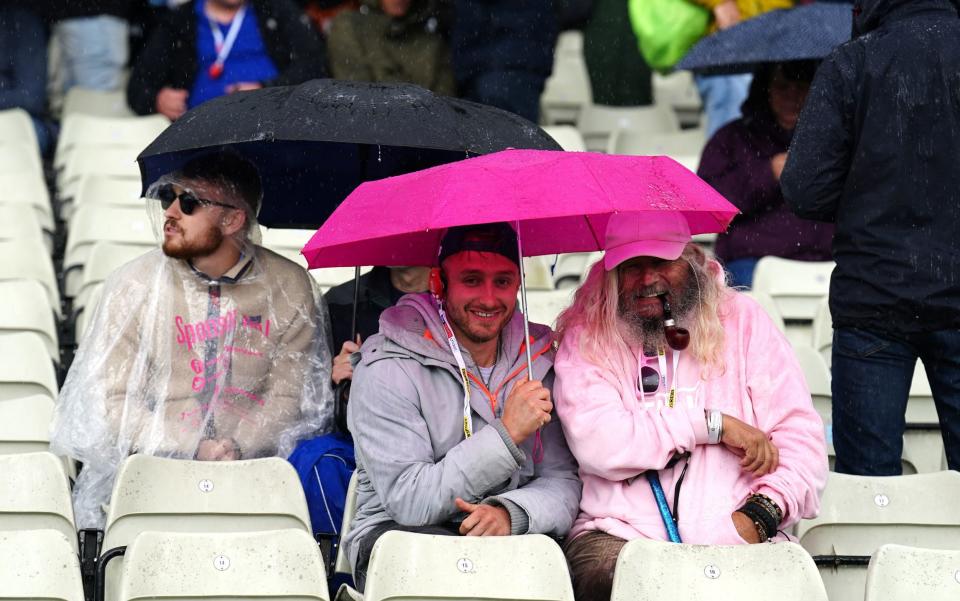 Sheltering from the rain at Edgbaston -  PA