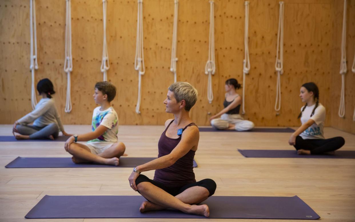 Zen: Suzanne Gribble teaching a class of teenagers at Triyoga in Ealing, West London -  Heathcliff O'Malley