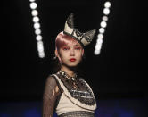 A model wears a design from Anna Sui's Spring 2013 collection during Fashion Week in New York, Wednesday, Sept. 12, 2012. (AP Photo/Seth Wenig)
