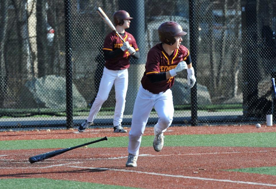 Weymouth's Andrew Daley races to first after hitting a fly ball against North Quincy during high school baseball at Libby Field in Weymouth, Tuesday, April 4, 2023.