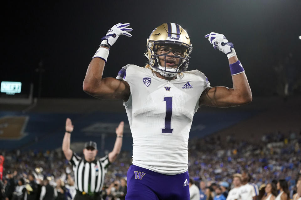 Washington wide receiver Rome Odunze (1) celebrates his touchdown catch against UCLA during the first half of an NCAA college football game Friday, Sept. 30, 2022, in Pasadena, Calif. (AP Photo/Marcio Jose Sanchez)