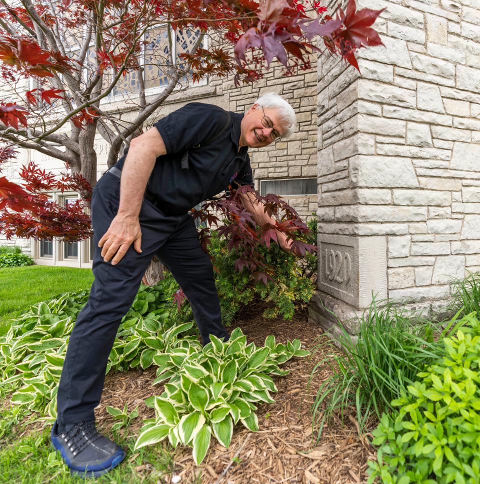 Pastor Don Francis reveals the cornerstone of the Wauwatosa Avenue United Methodist Church on Friday, May 20, 2022. The original church, built in 1860, burned down in 1919 and was rebuilt in 1920. The congregation is celebrating its 175th anniversary this month. The church is the oldest in Wauwatosa and one of the oldest in the state.