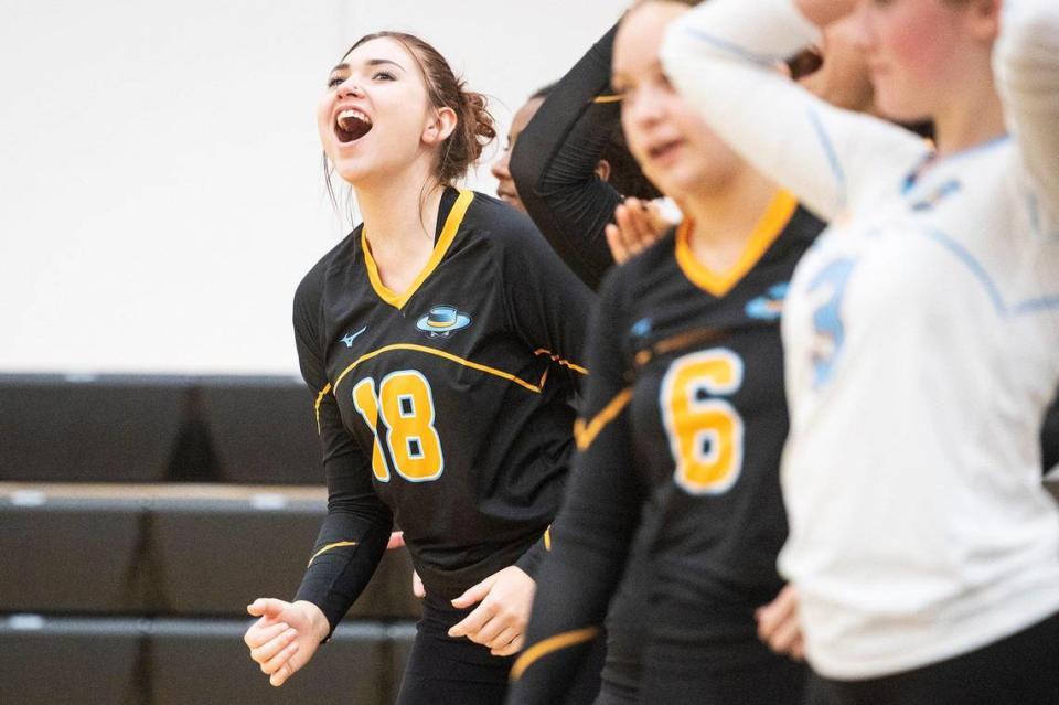 El Capitan sophomore Mia Griffie (18) and the rest of the Gauchos bench celebrate a point during a match against Merced at Merced High School in Merced, Calif., on Wednesday, Oct. 4, 2023. The Gauchos swept the Bears 3-0.