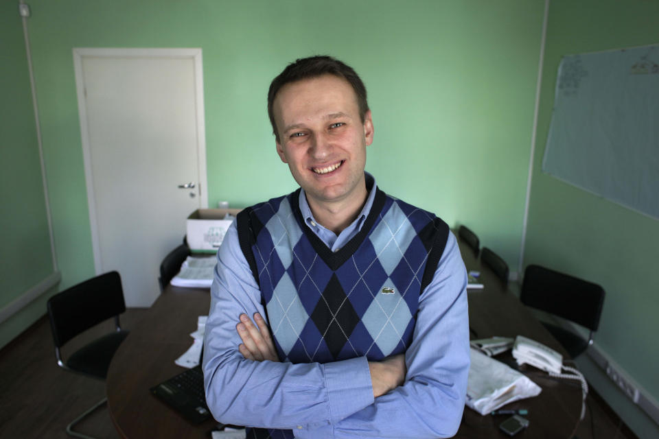 FILE - In this March 17, 2010, file photo, corporate Russian lawyer Alexei Navalny poses in his office in Moscow, Russia. Navalny is an anti-corruption campaigner and the Kremlin’s fiercest critic. He has outlasted many opposition figures and is undeterred by incessant attempts to stop his work. (AP Photo/Alexander Zemlianichenko, File)