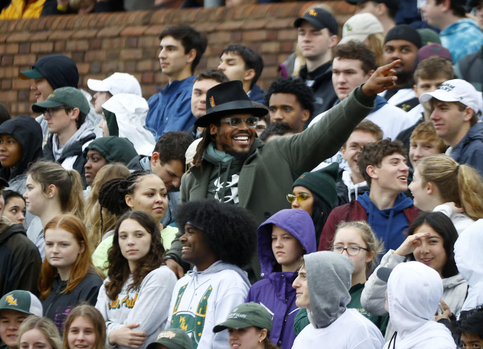 mer Carolina Panthers' quarterback, Cam Newton, center, attends the first half of an FCS playoffs NCAA college football game between William & Mary and Gardner-Webb at The College of William and Mary in Williamsburg, Va. on Saturday, Dec. 3, 2022. (Daniel Sangjib Min/Richmond Times-Dispatch via AP)