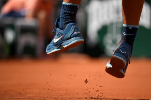 Shoe in!: Details of his shoes as Spain's Rafael Nadal serves