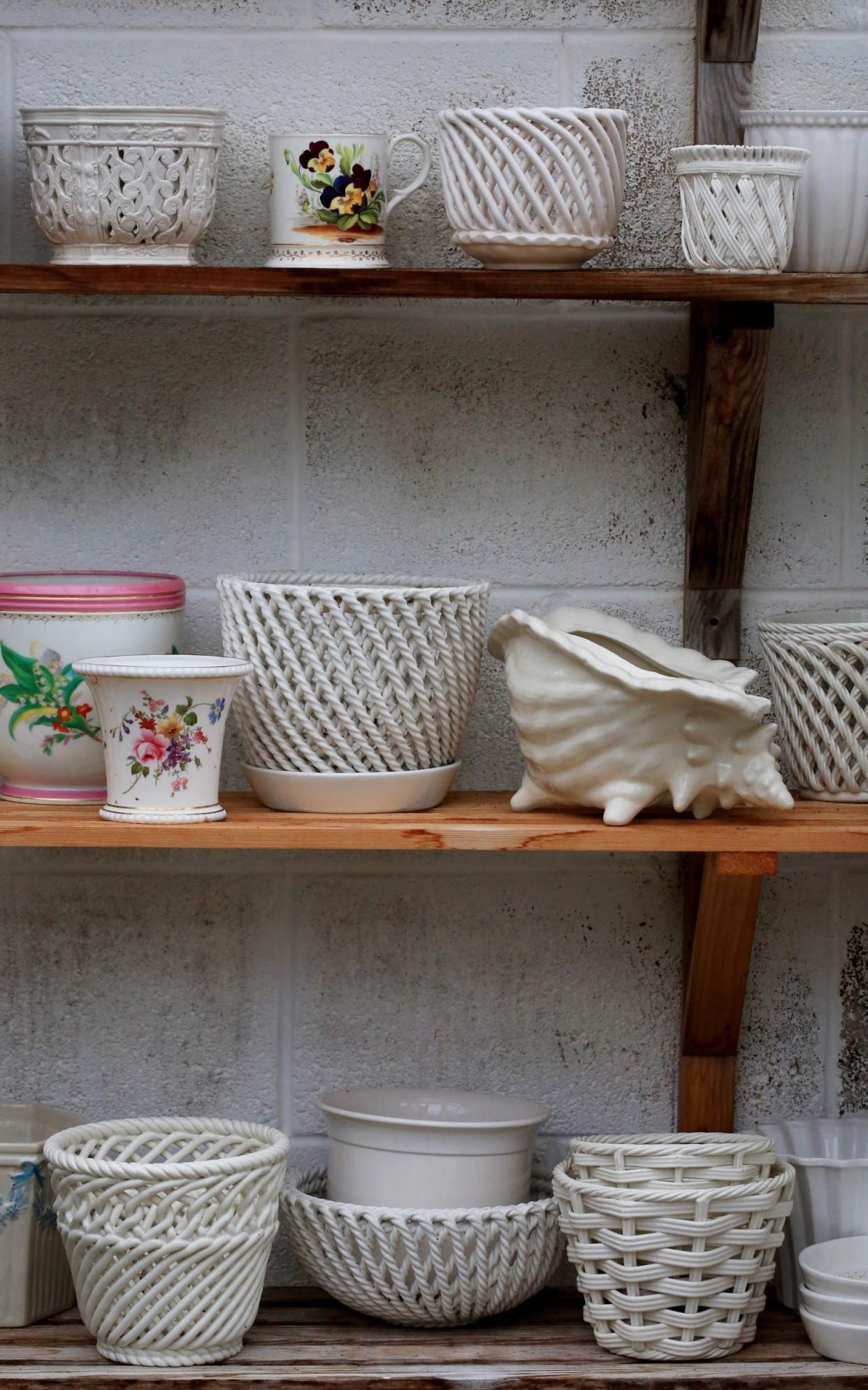 A range of ceramic pots in the potting shed of Cath Kidston's garden in Gloucestershire