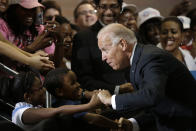 Vice President Joe Biden greets Lawrence Smith, 8, and Madison King, 9, both of Van Buren Township, Mich., during a campaign stop at Renaissance High School, Wednesday, Aug. 22, 2012, in Detroit. (AP Photo/Paul Sancya)