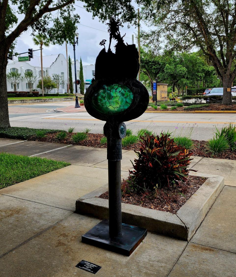 "Florida Springs I," a bronze and glass piece by Judith Greavu, of Bluffton, Ohio, is pictured here off South Woodland Boulevard in front of Mainstreet Community Bank of Florida.