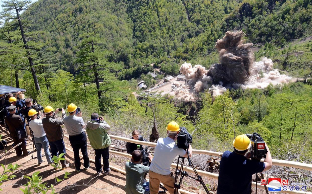 Journalists watch as North Korea's nuclear test site is dismantled - REUTERS